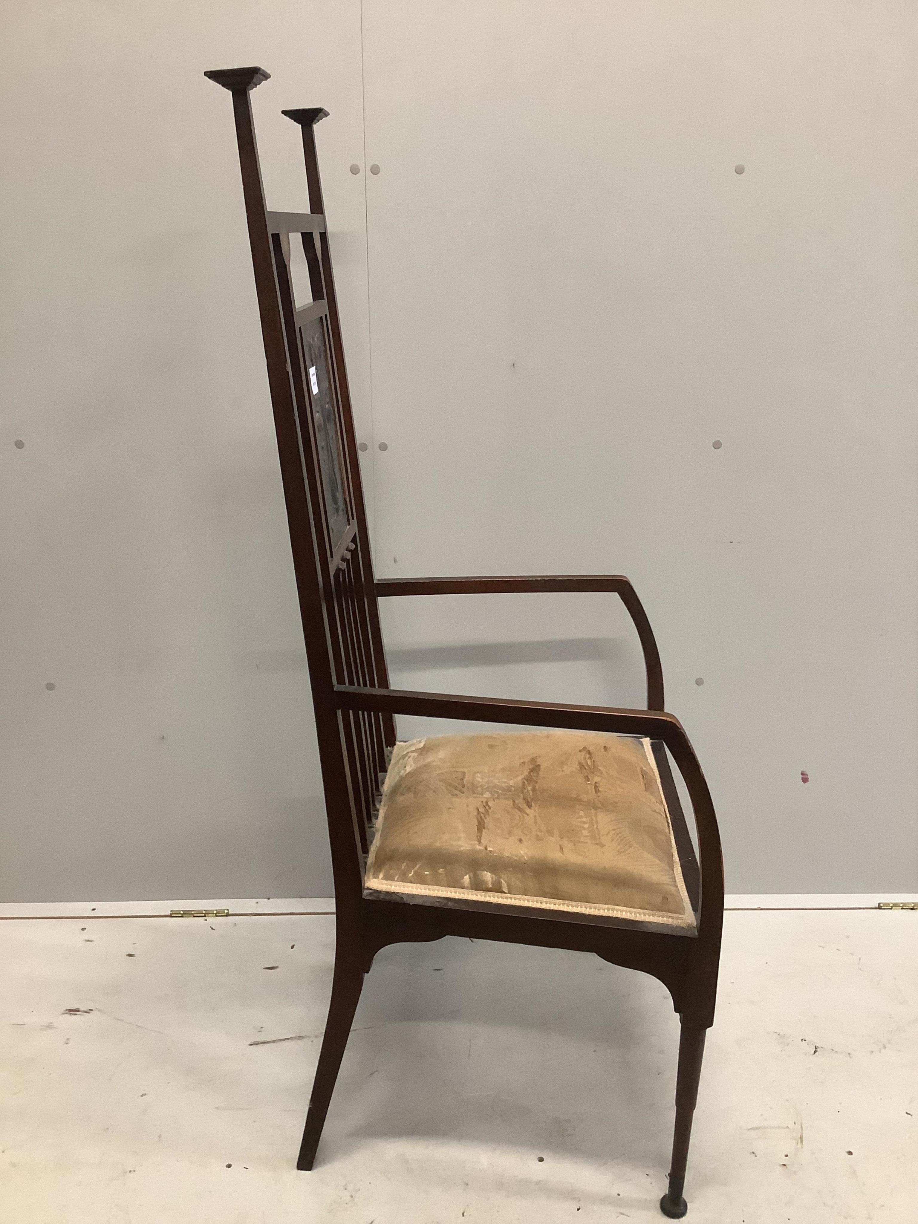 In the manner of Shapland & Petter, an Art Nouveau mahogany high backed elbow chair, the back inset with an embossed copper plaque, width 56cm, depth 48cm, height 138cm. Condition - fair